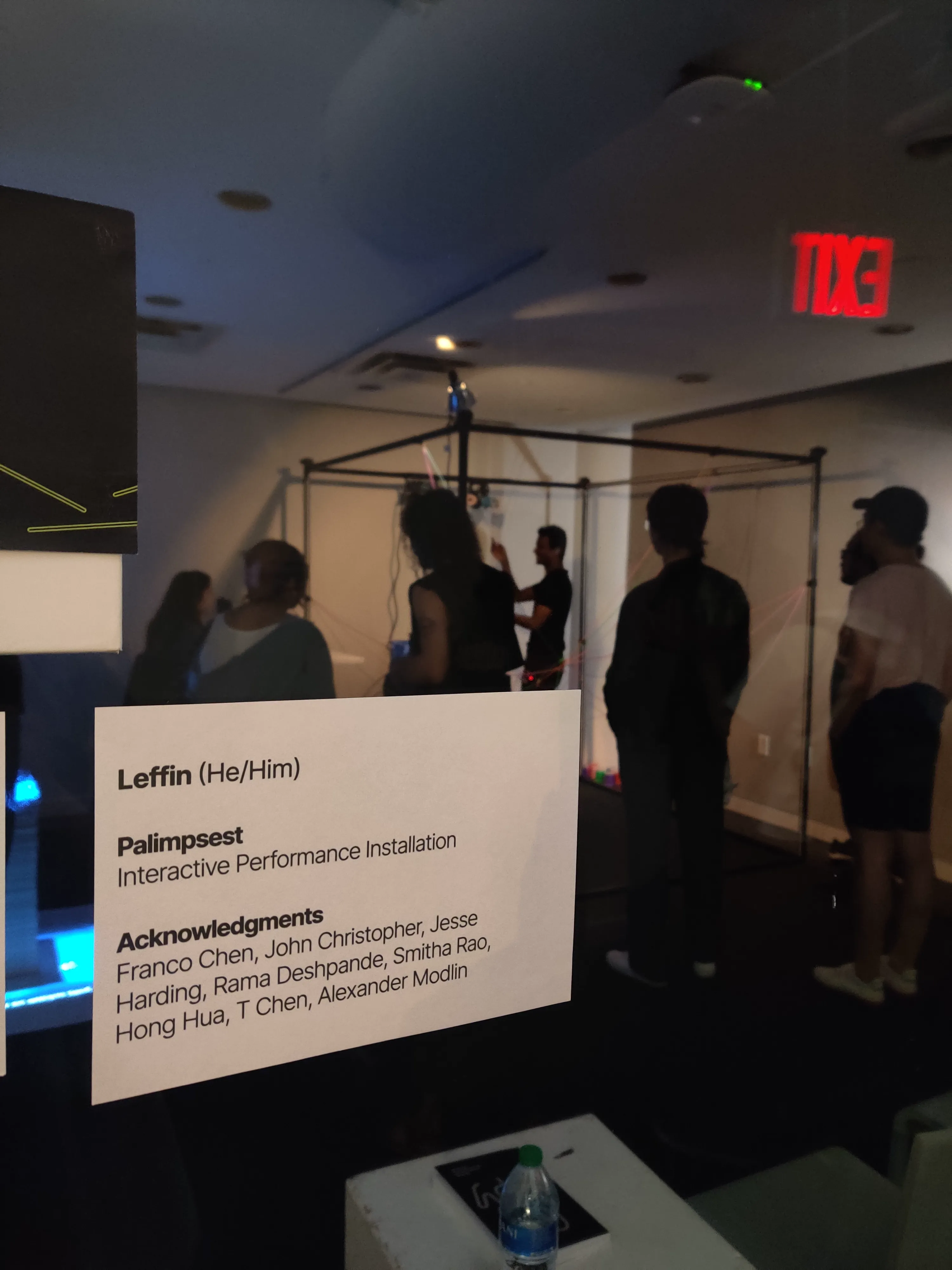 Leffin reaching up to adjust the thread mechanism during a live performance